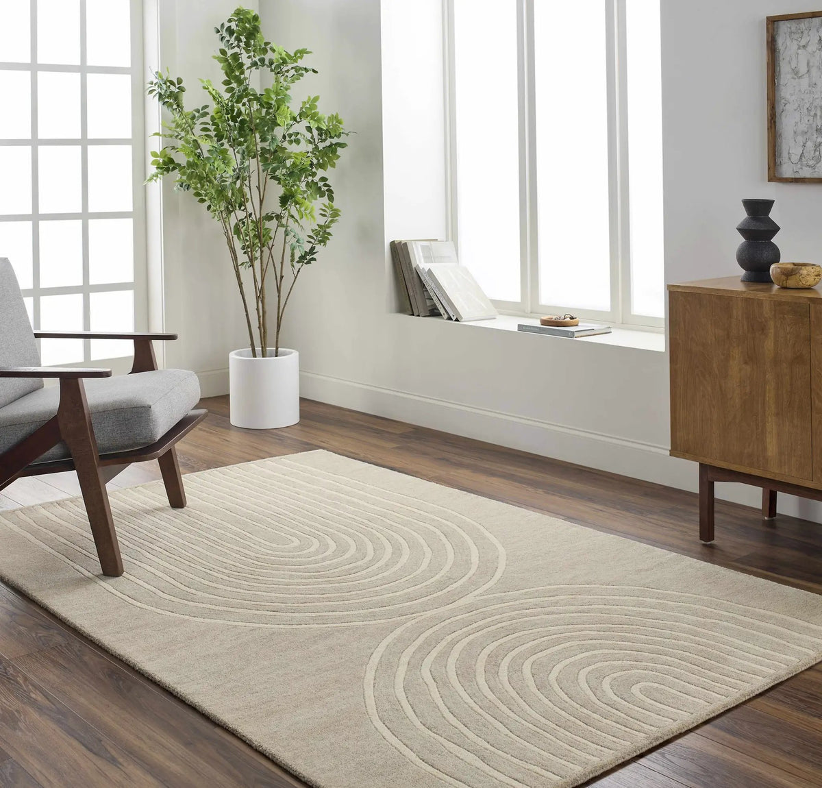 Fuat Tan Area Rug - Clearance, installed in a room