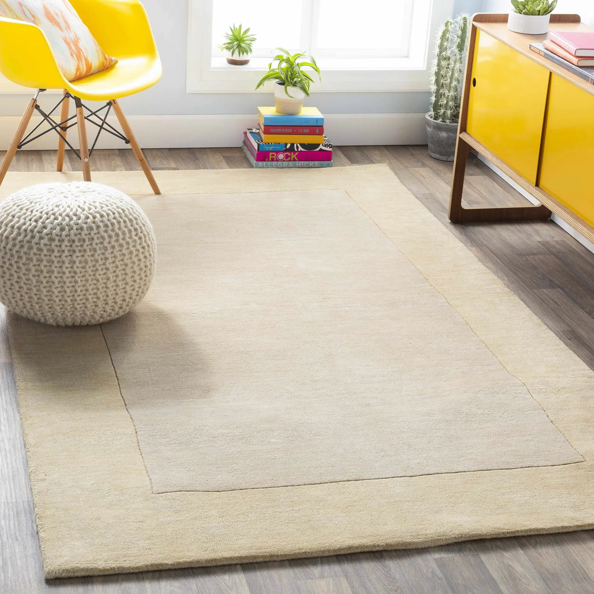 Bordered Solid Beige Wool Rug, installed in a room