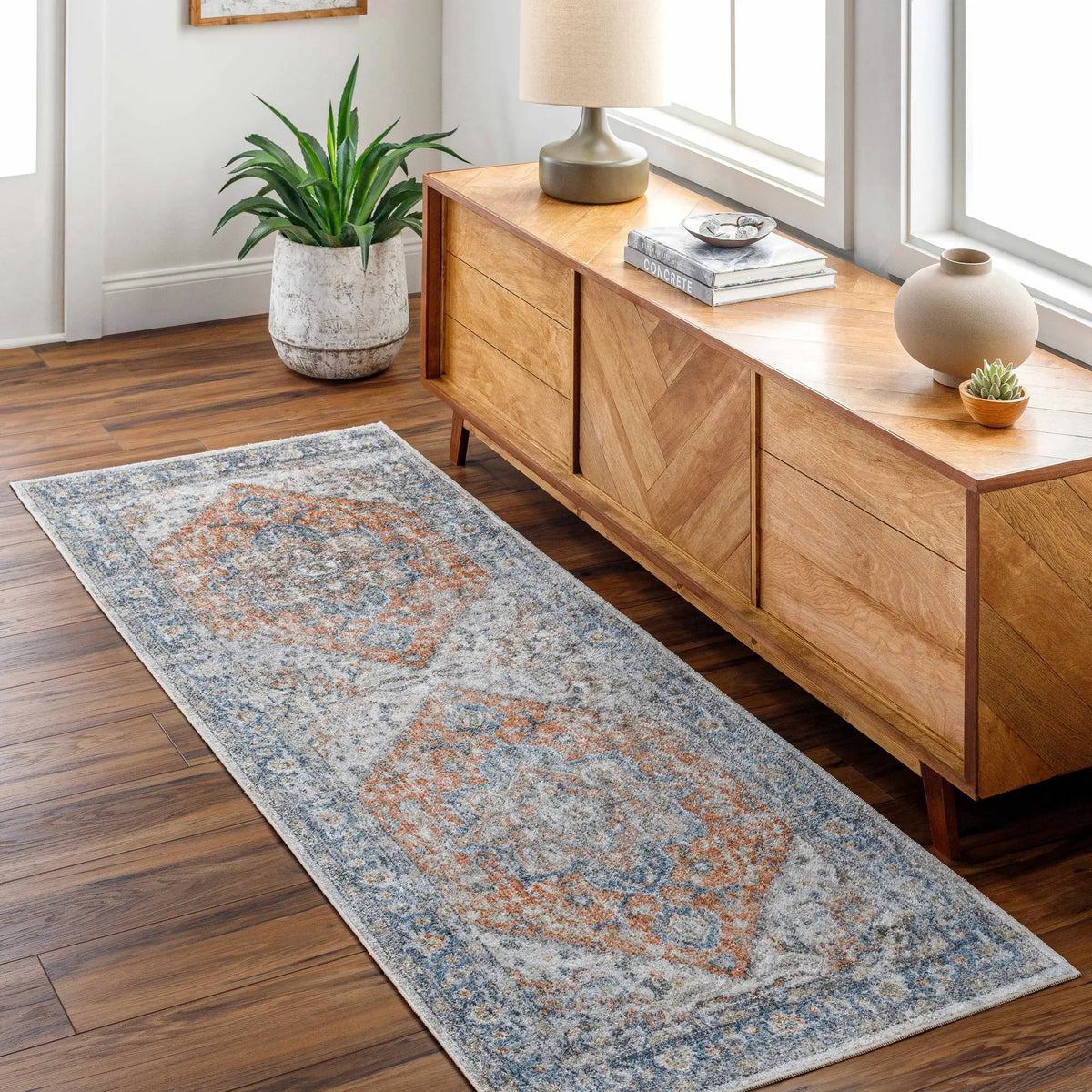 Ezri Rust Washable Area Rug, installed in a room