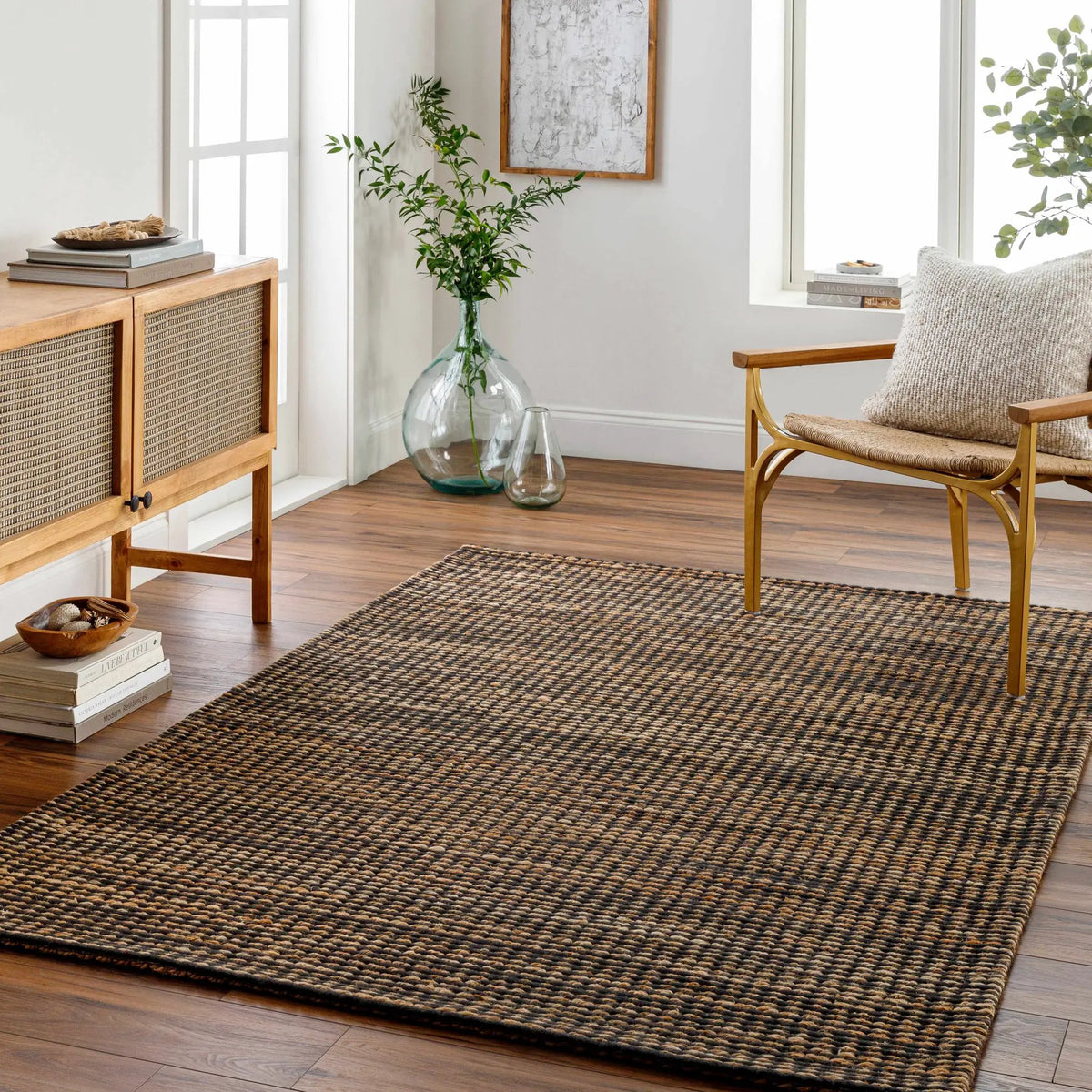 Riki Black Area Rug, installed in a room