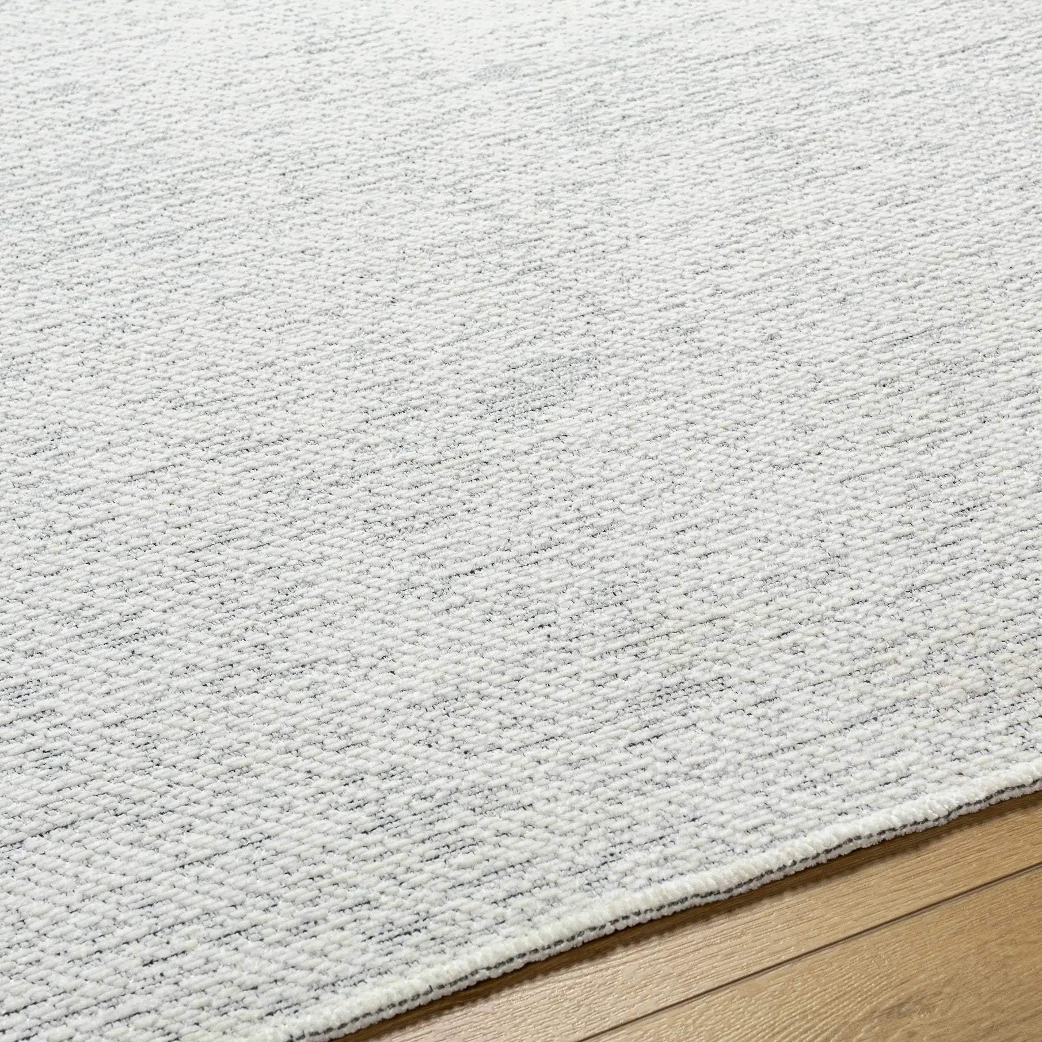 Isako Cream & Gray Solid Washable Area Rug - Clearance by Boutique Rugs