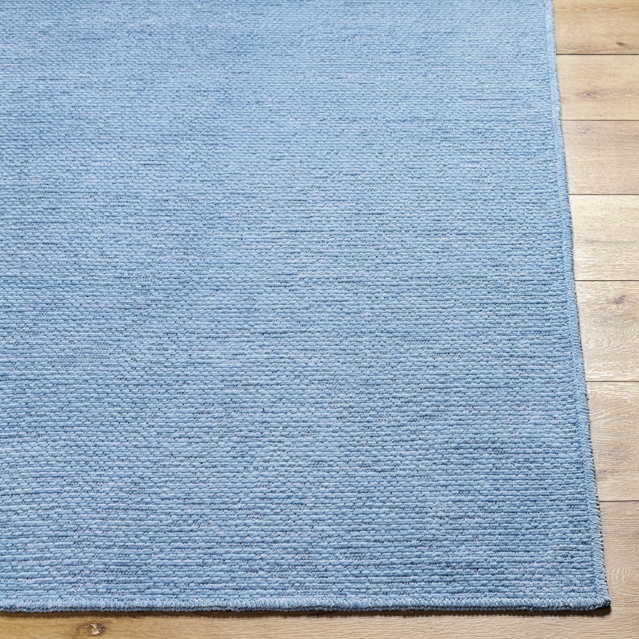 Isako Blue Solid Washable Area Rug - Clearance by Boutique Rugs
