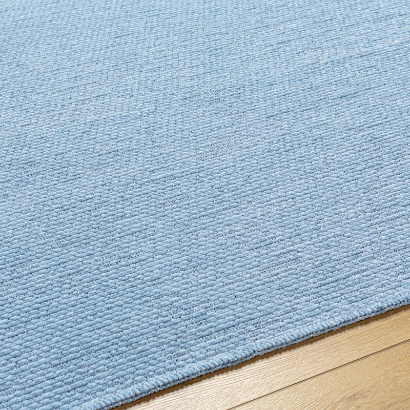 Isako Blue Solid Washable Area Rug - Clearance by Boutique Rugs