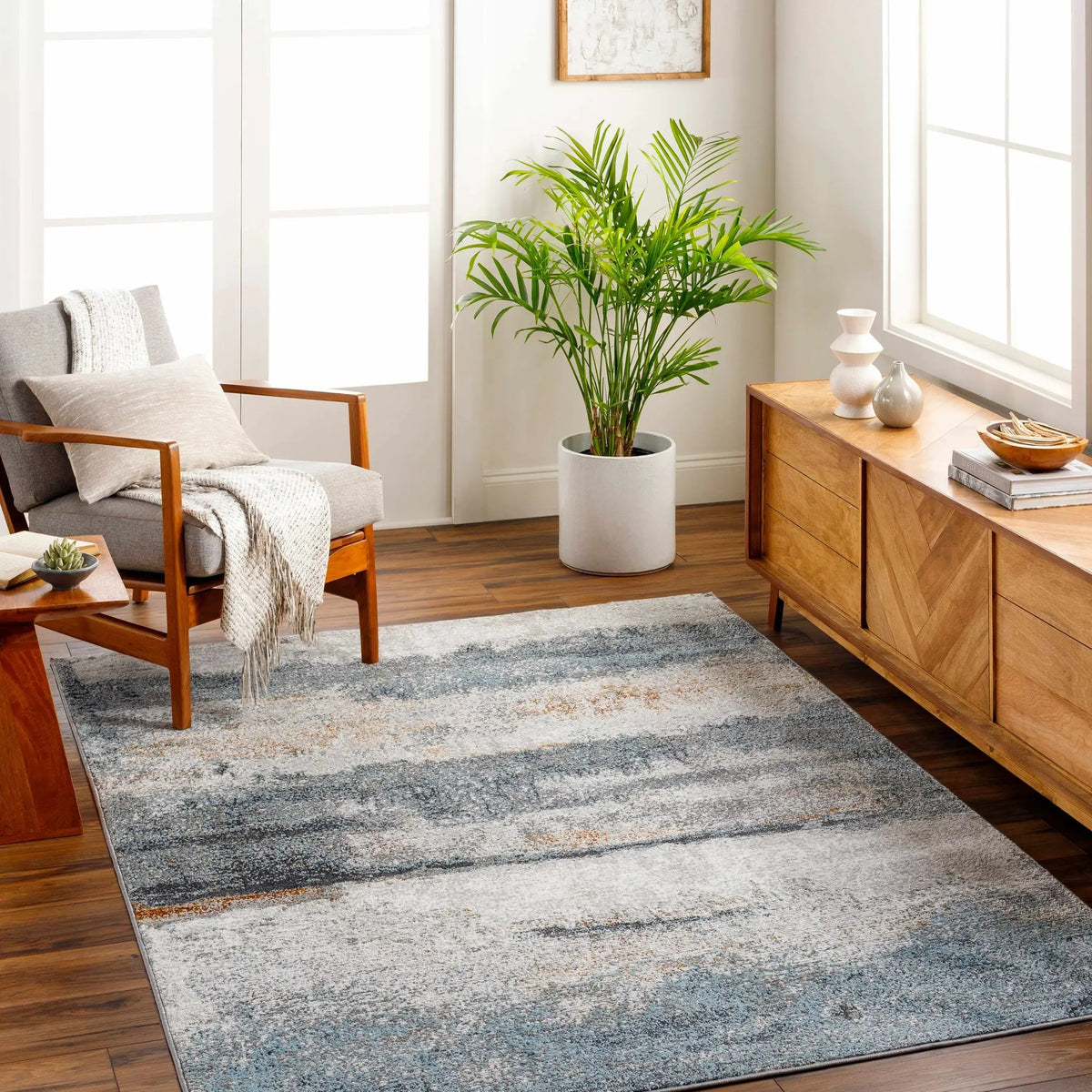 Adam Gray Blue Abstract Area Rug, installed in a room