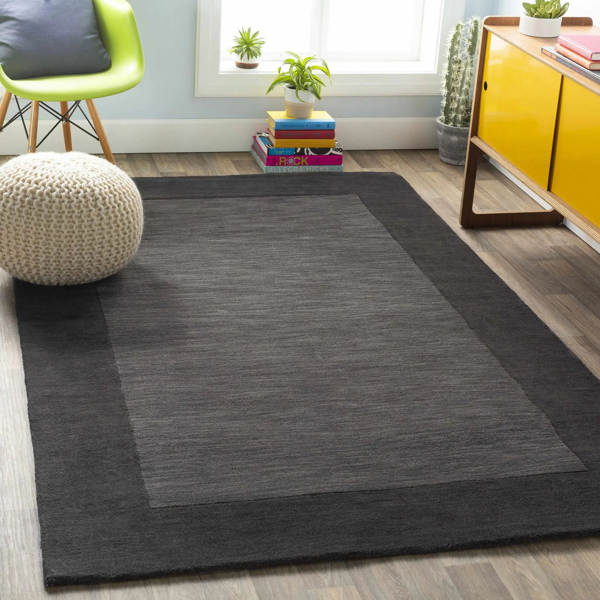 Bordered Solid Black Charcoal Wool Rug, installed in a room 2
