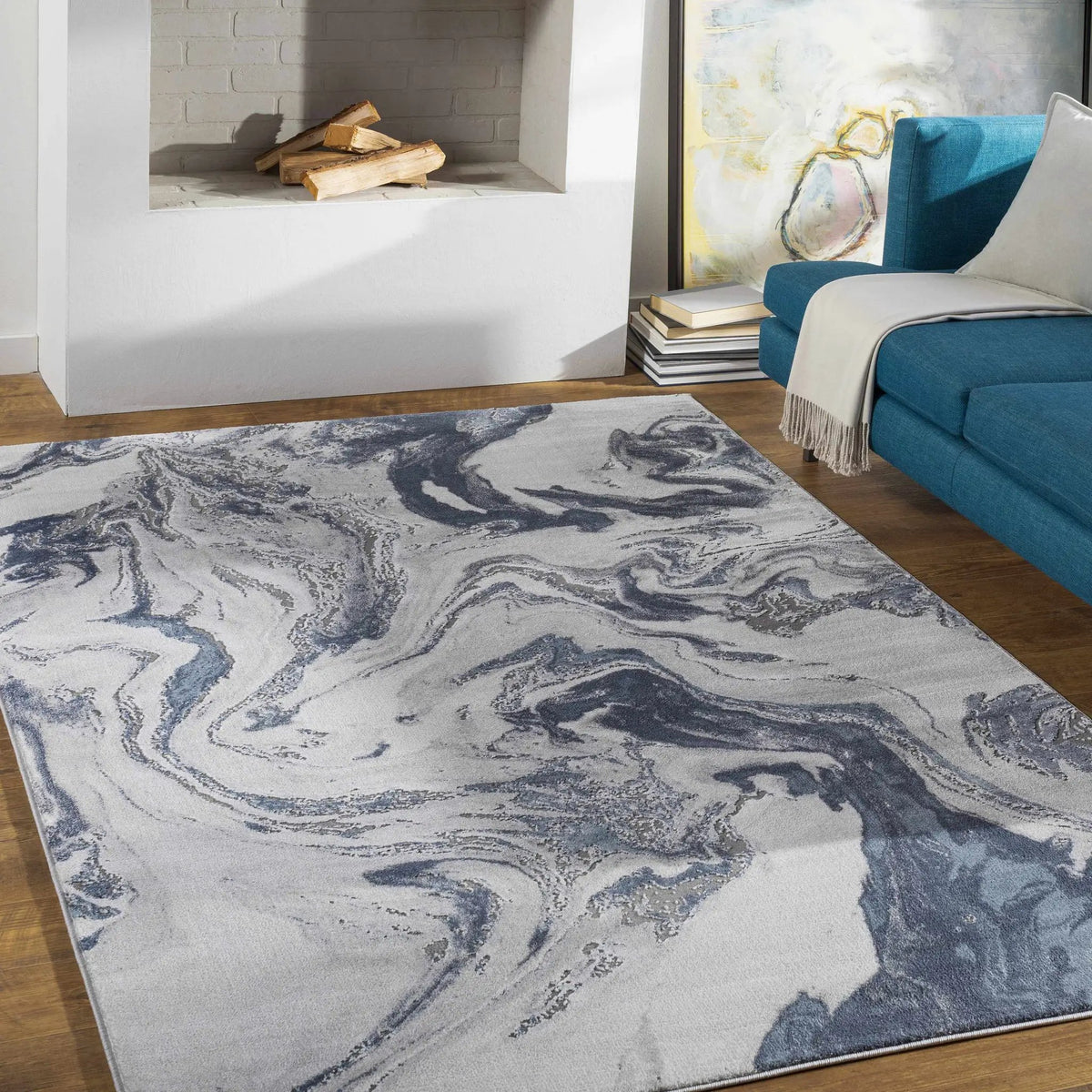 Moana Denim Blue Marble Area Rug, installed in a room