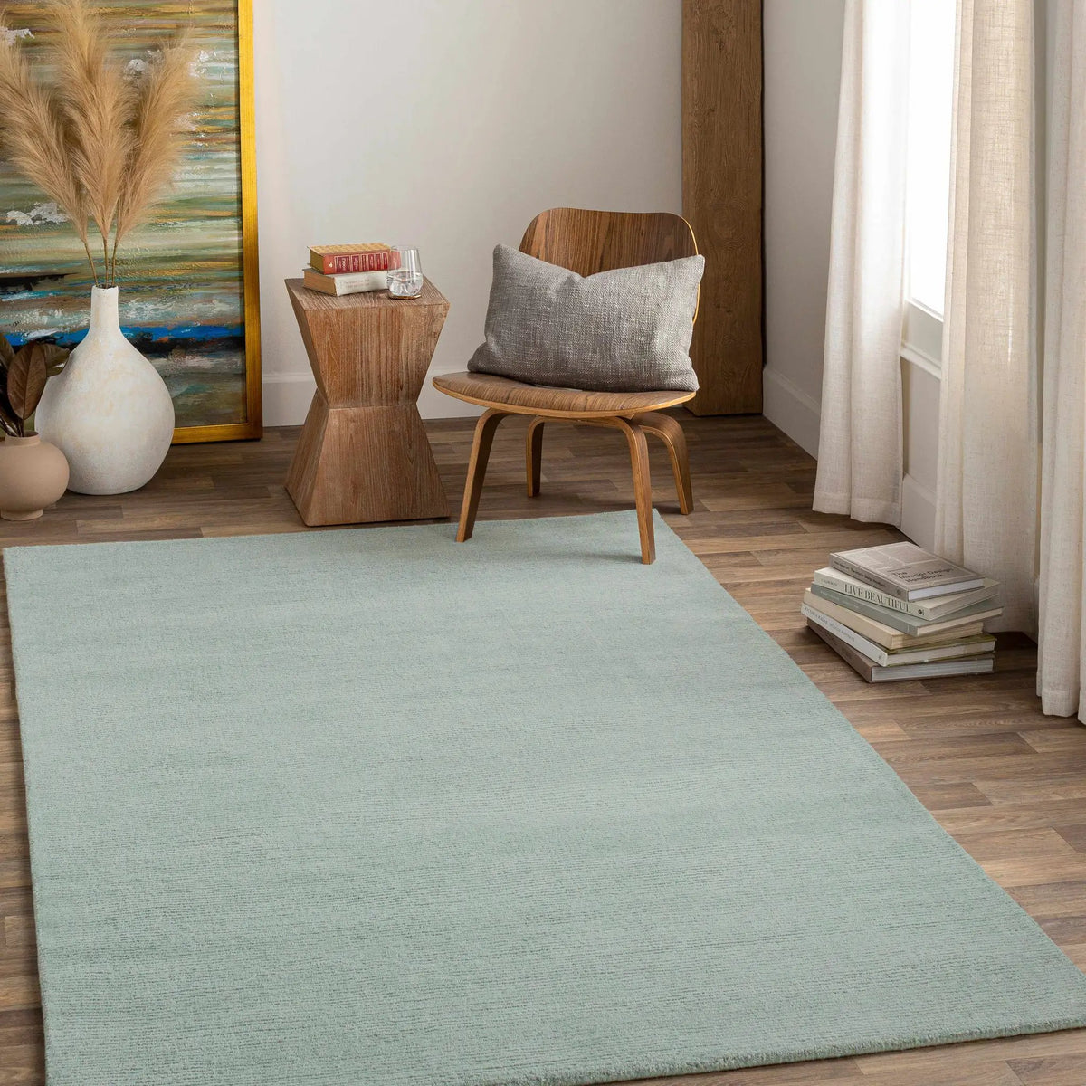 Brockton Solid Dusty Sage Wool Rug, installed in a room