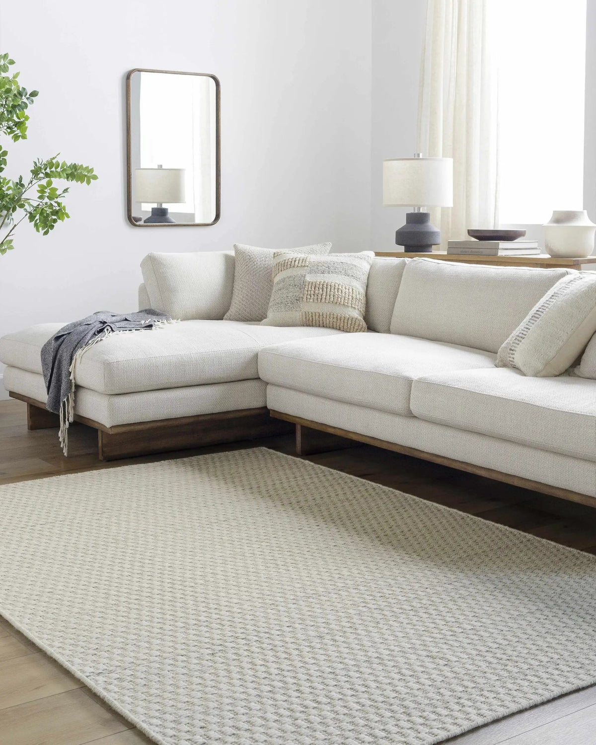 Tevah Siver Wool Rug, installed in a room