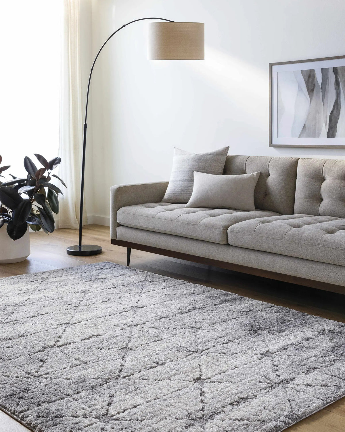 Tyree Distressed Gray Trellis Area Rug, installed in a room