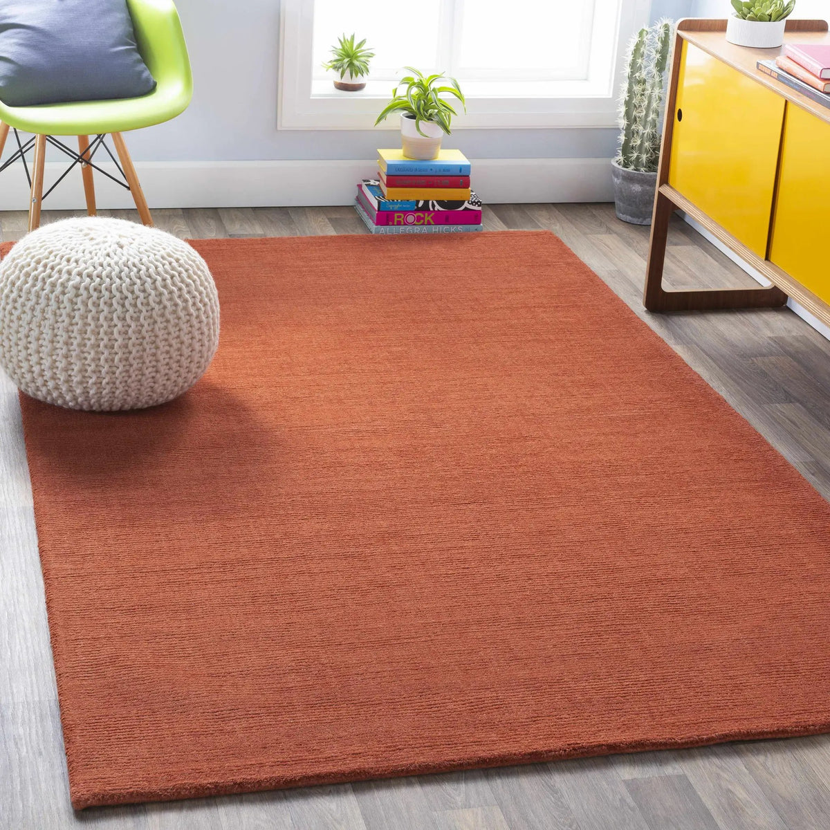 Brockton Solid Orange Wool Rug, installed in a room