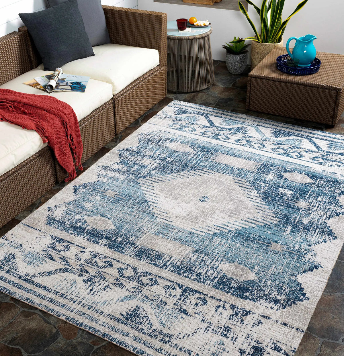 Westmount Denim Aztec Outdoor Area Rug, installed in a room